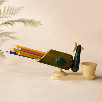 Decorative peacock-shaped pencil holder with colorful pencils, handcrafted in channapatna