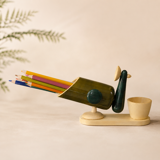 Decorative peacock-shaped pencil holder with colorful pencils, handcrafted in channapatna