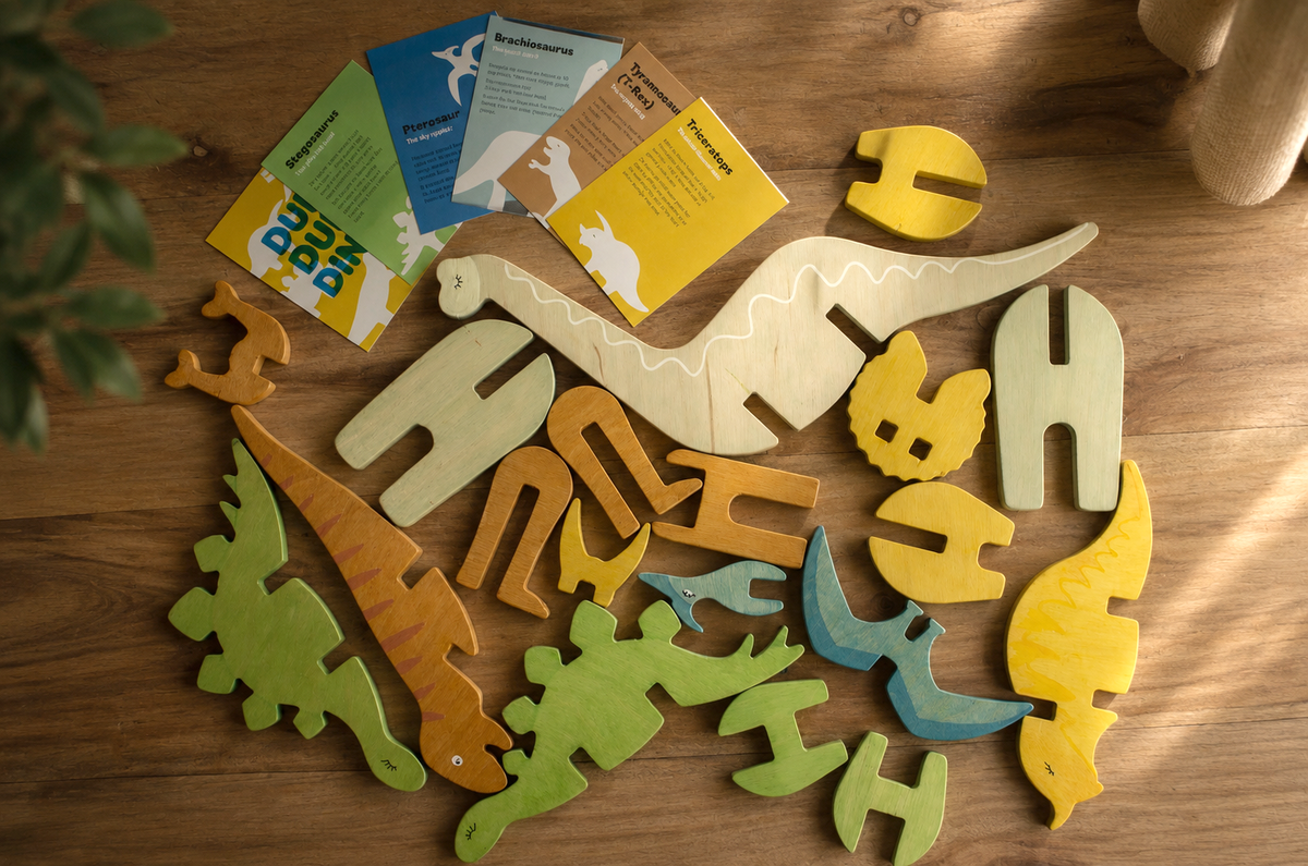 Colorful dinosaur playset toy parts from top with information cards