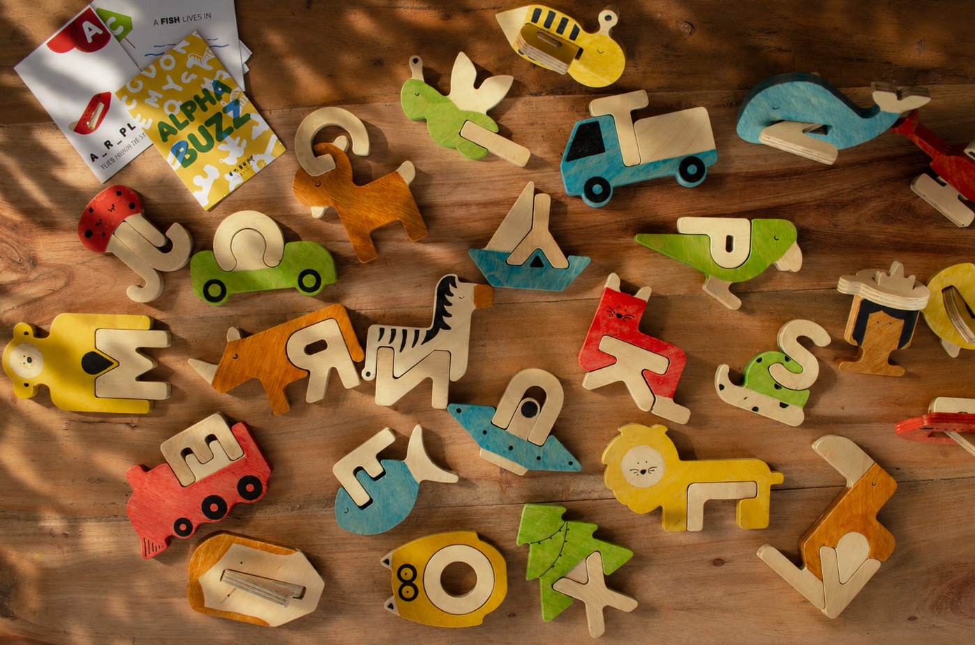 Colorful wooden letters and shapes for language learning. 